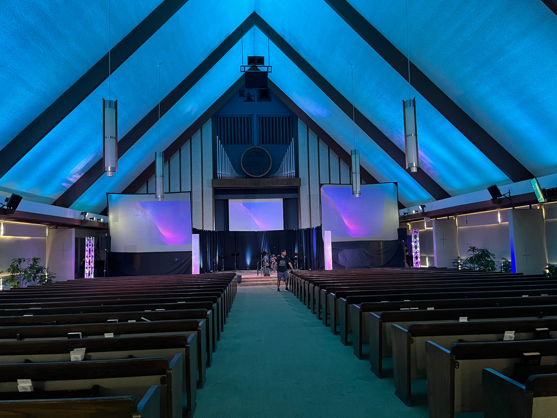 The sanctuary of Alhambra Seventh-day Adventist Church, seen from the center aisle toward the pulpit